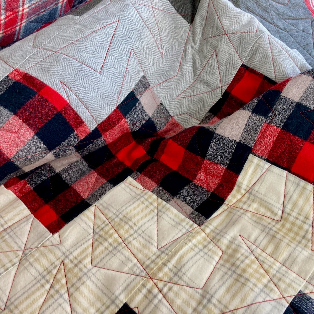 Flannel quilt quilted with a triangle design