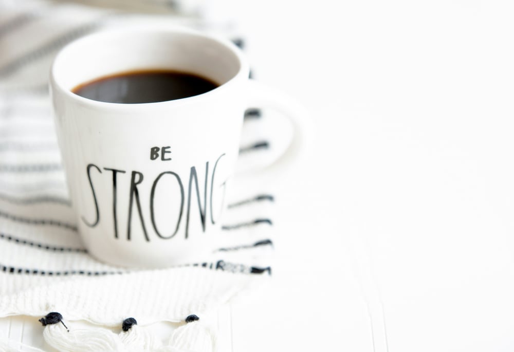 coffee mug with the text be strong