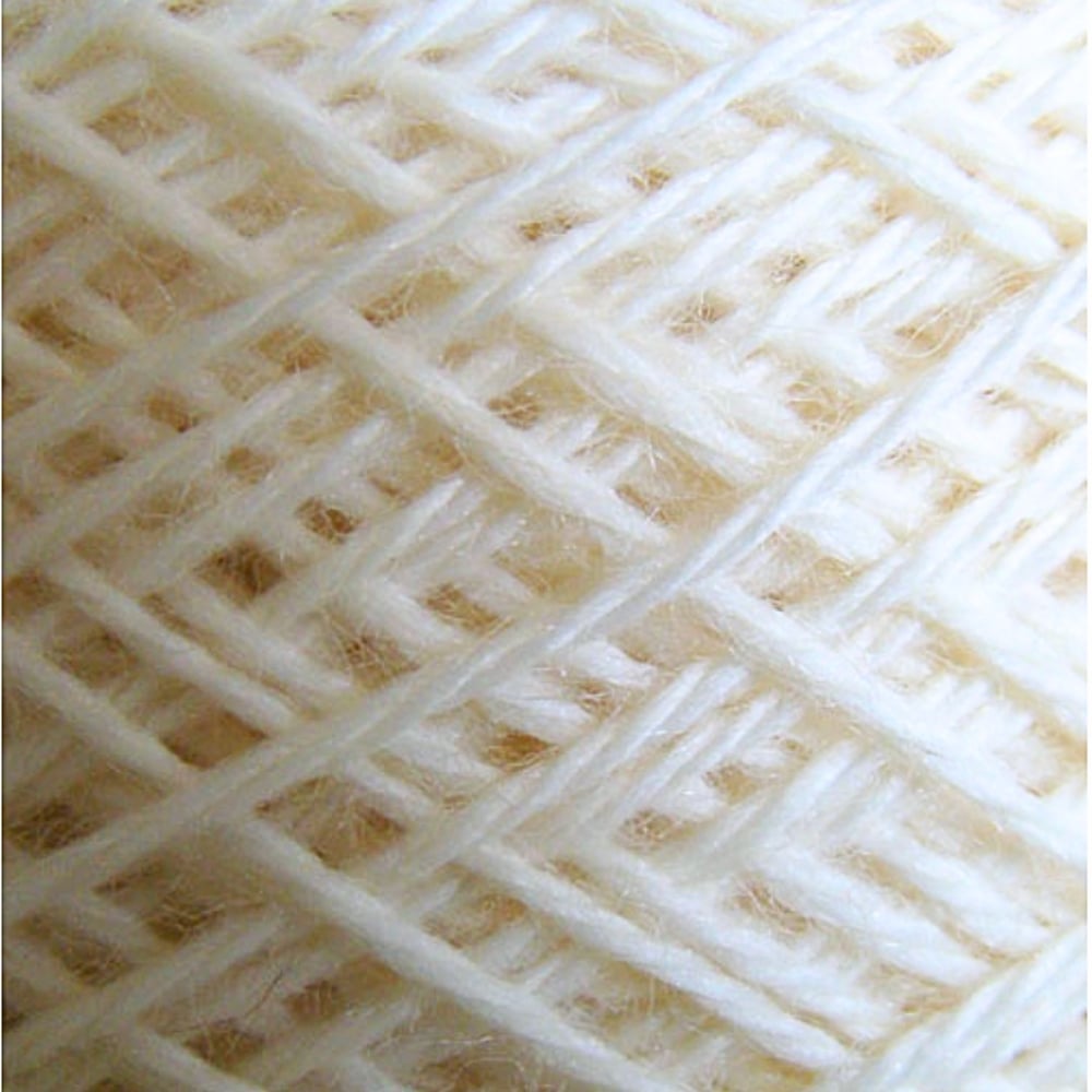 Close up of the twist in a cake white yarn