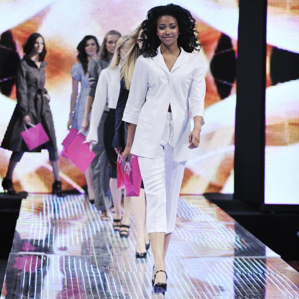 Black woman leading a fashion show, fashion models