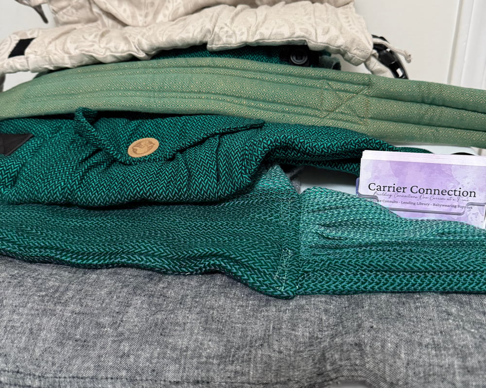 Five belts stacked in order from least structured to most structured. From front to back hope&plum meh dai, lenny wraptai, lenny hybrid, girasol tie belt, Stokke Limas