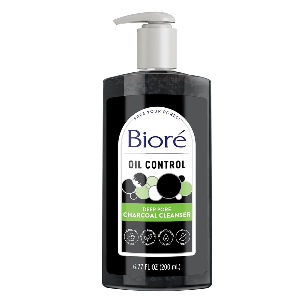 A clear pump bottle of Bioré Oil Control Deep Pore Charcoal Cleanser, labeled as 6.77 fl oz (200 mL), featuring black liquid and graphics of charcoal and bubbles—a salicylic acid cleanser for blackheads.