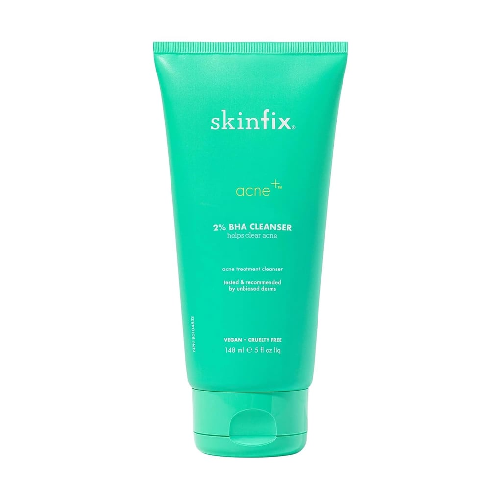 A green tube of Skinfix Acne+ 2% BHA Cleanser, 148 ml (5 fl oz). This vegan, cruelty-free salicylic acid cleanser for blackheads is recommended by dermatologists as an effective acne treatment.