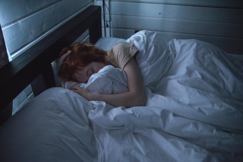 a woman unable to sleep due to poor sleep patterns