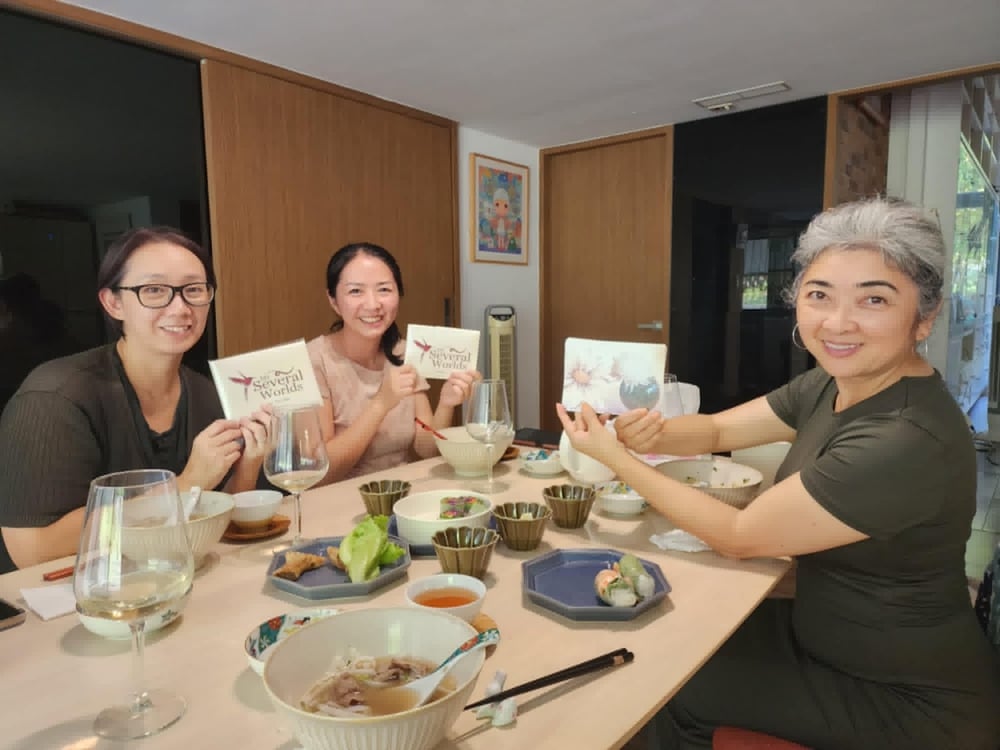 Three women in Taiwan hold up my Taiwan ikebana and orchid postcard sets. These come in a set of six postcards in their own custom My Several Worlds box. They make excellent gifts and they're the perfect gift for folks who love snail mail!