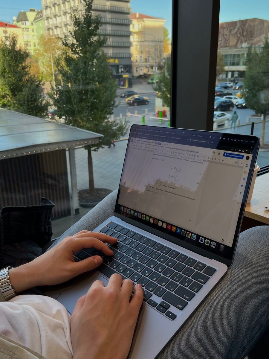 a student creating digital products on a laptop