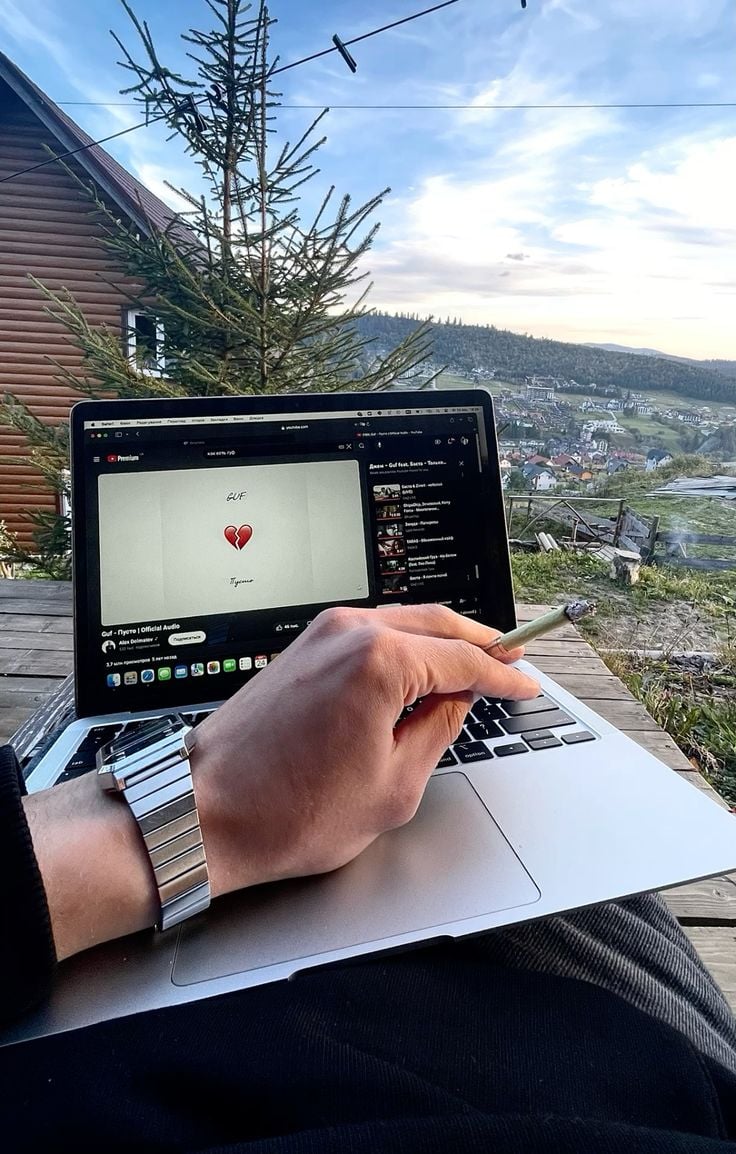 a student creating digital products on a laptop