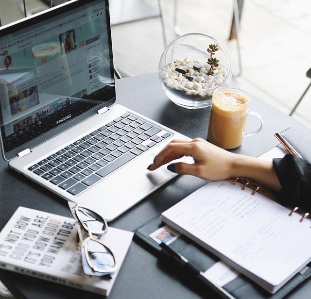 a student creating digital products on a laptop