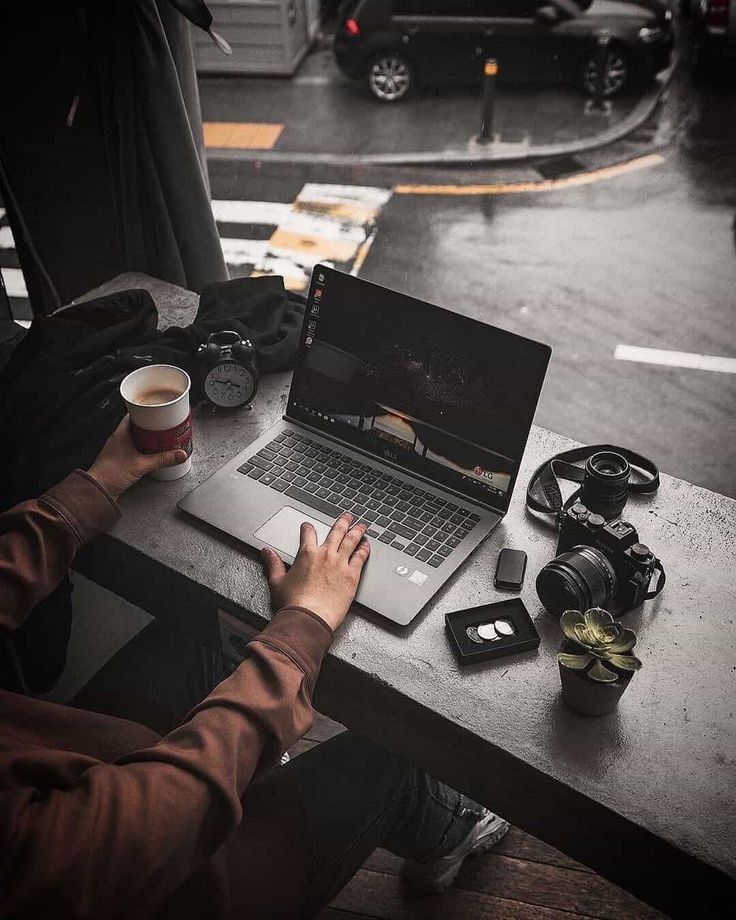 a student creating digital products on a laptop