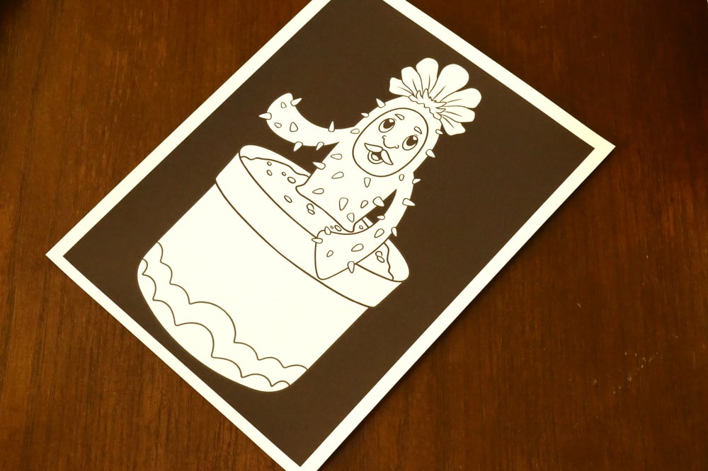 A black and white coloring sheet showing a cactus in a pot.