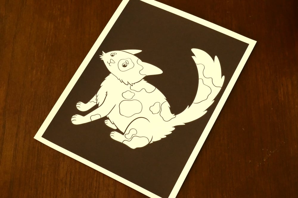 A black and white coloring sheet showing a cat.
