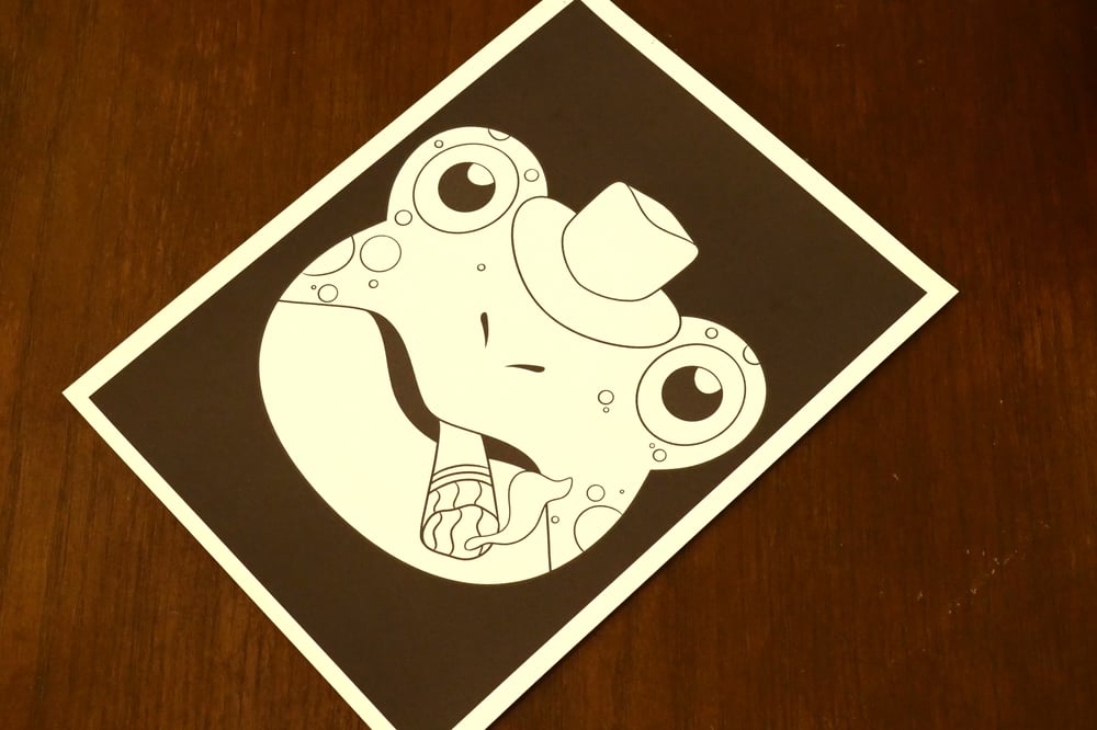 A black and white coloring sheet showing a frog smoking a cigar.
