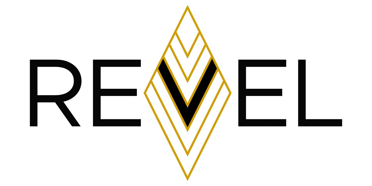 Diamond shape outlined in gold with gold and white v shaped stripes with center stripe in black representing the letter "V" with the letters RE to the left of diamond and EL to the right to spell out Revel; this is the brand logo for Revel yarn and knit and crochet patterns.