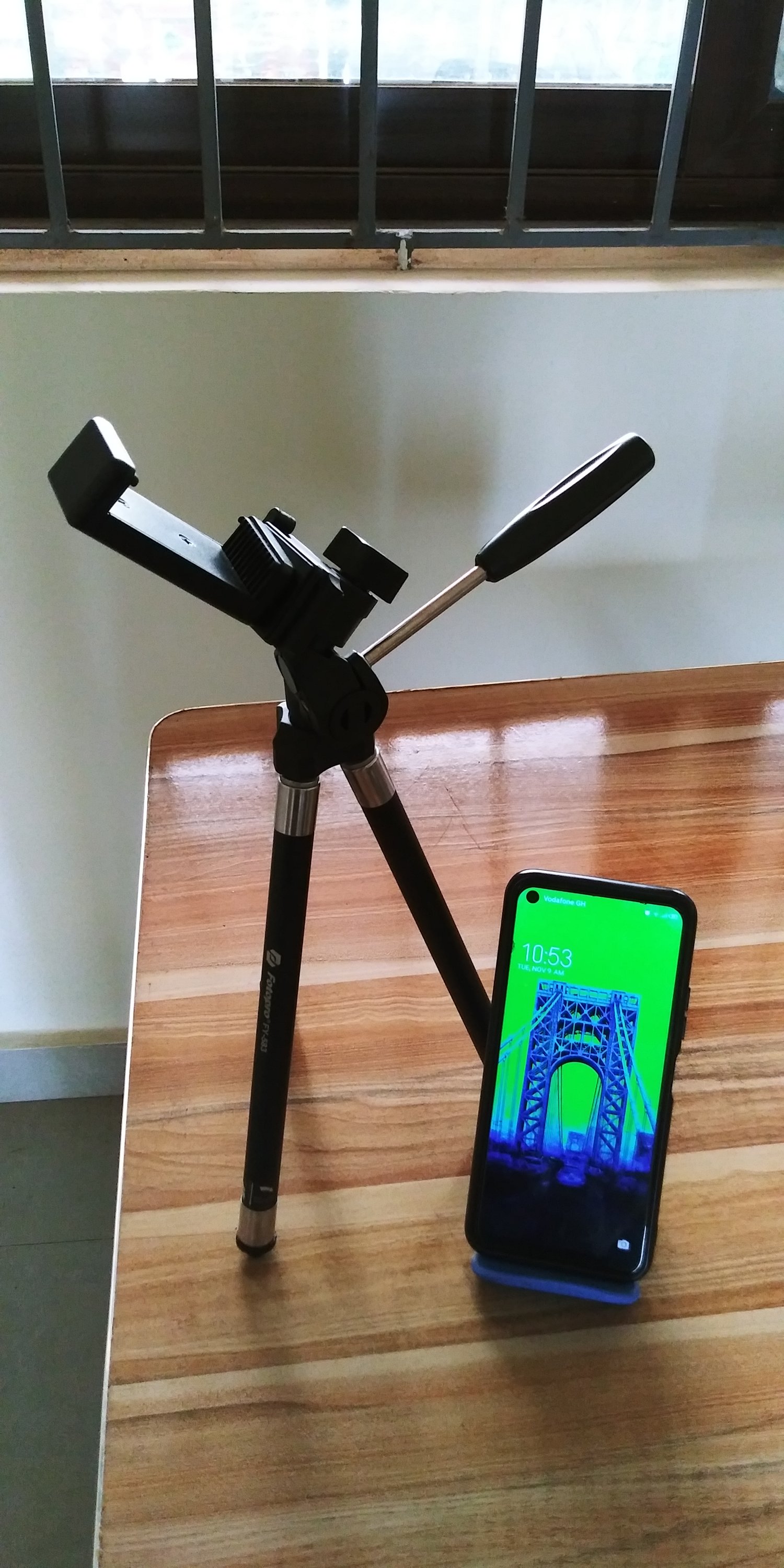 Tecno Spark 5 Pro and Fotopro camera stand used by DSJRecreations as current photography gear.