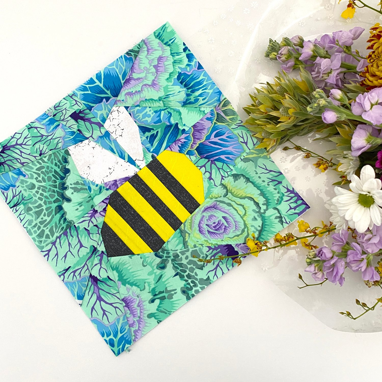 Nine awesome (and totally free) paper pieced quilt patterns that beginners could make! The picture shows the Free Bumble Bee Pattern by Kohatu Patterns