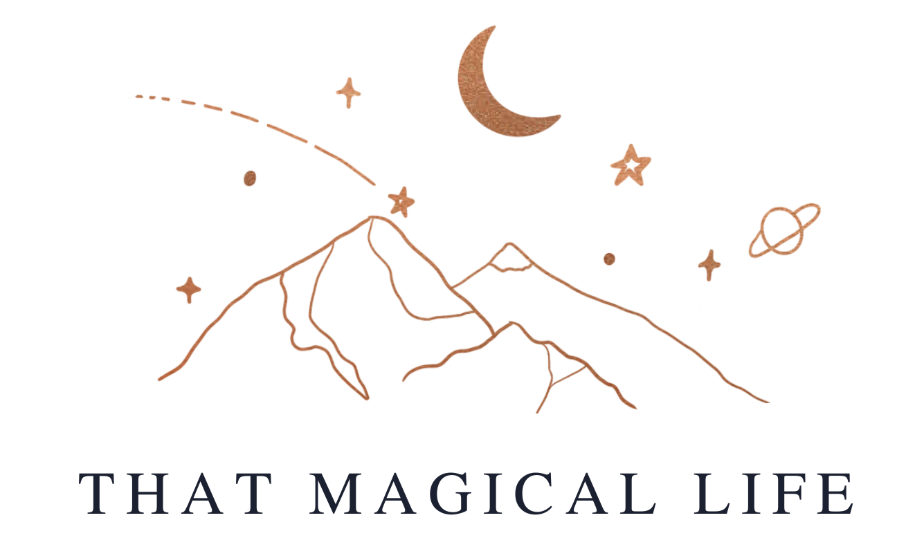 That Magical Life logo. Copper mountains, stars and moon, with the words beneath