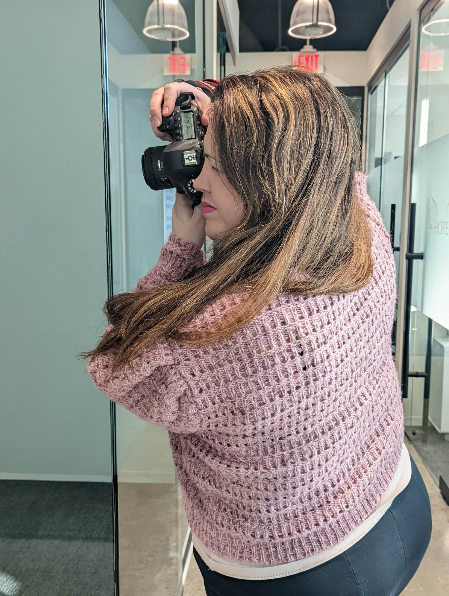 Photographing an entrepreneur during a branding photo session.