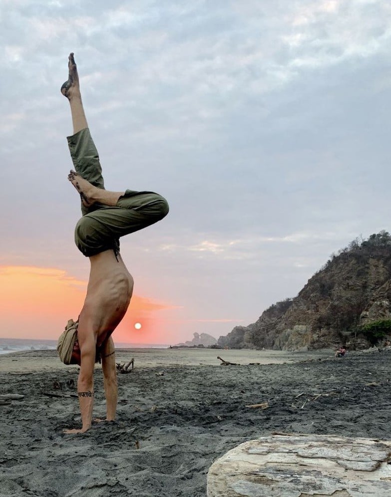 cale alit ashtanga yoga teacher performing handstand