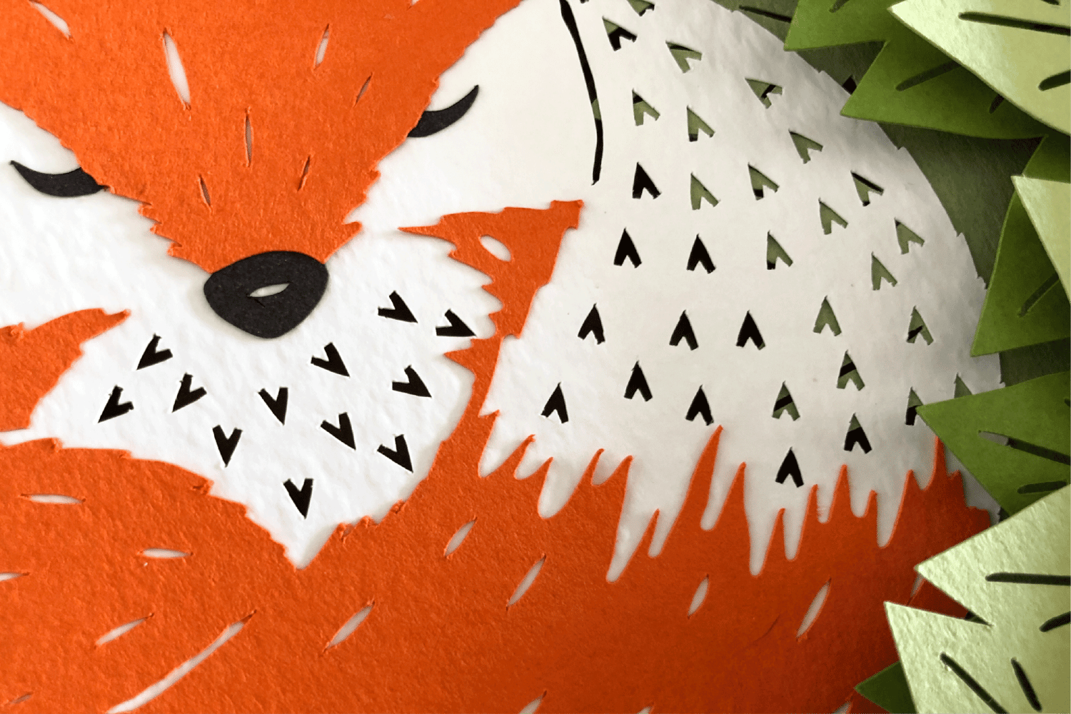 Close up of fox paper cut in a shadow box