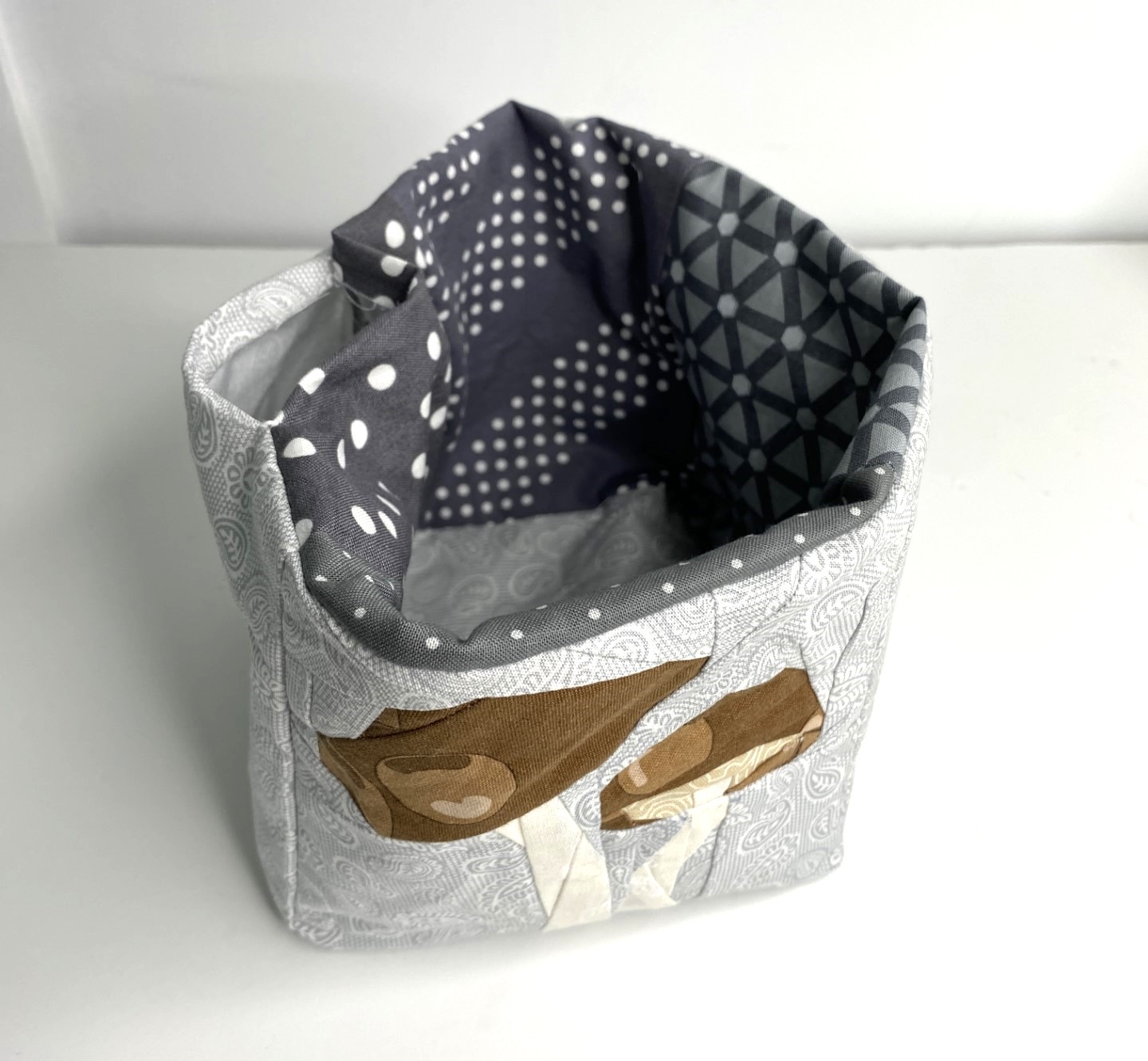 Press the top of the fabric storage box to a crisp edge and top-stitch around the top to close the hole in the lining.