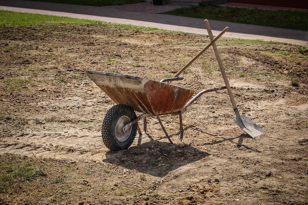 wheelbarrow, shovel, and rake