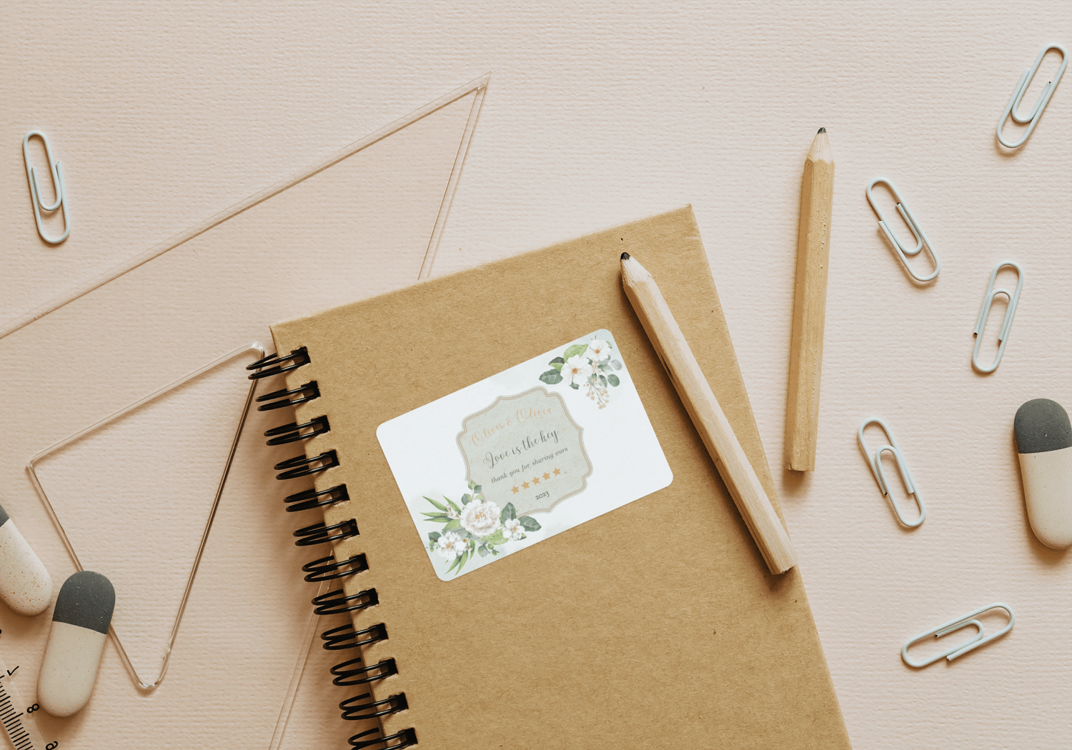 Elegant White Floral Photo Frame Sticker Label 3"x2" | Customizable Canva Template | Digital Download. Mock sticker on notebook