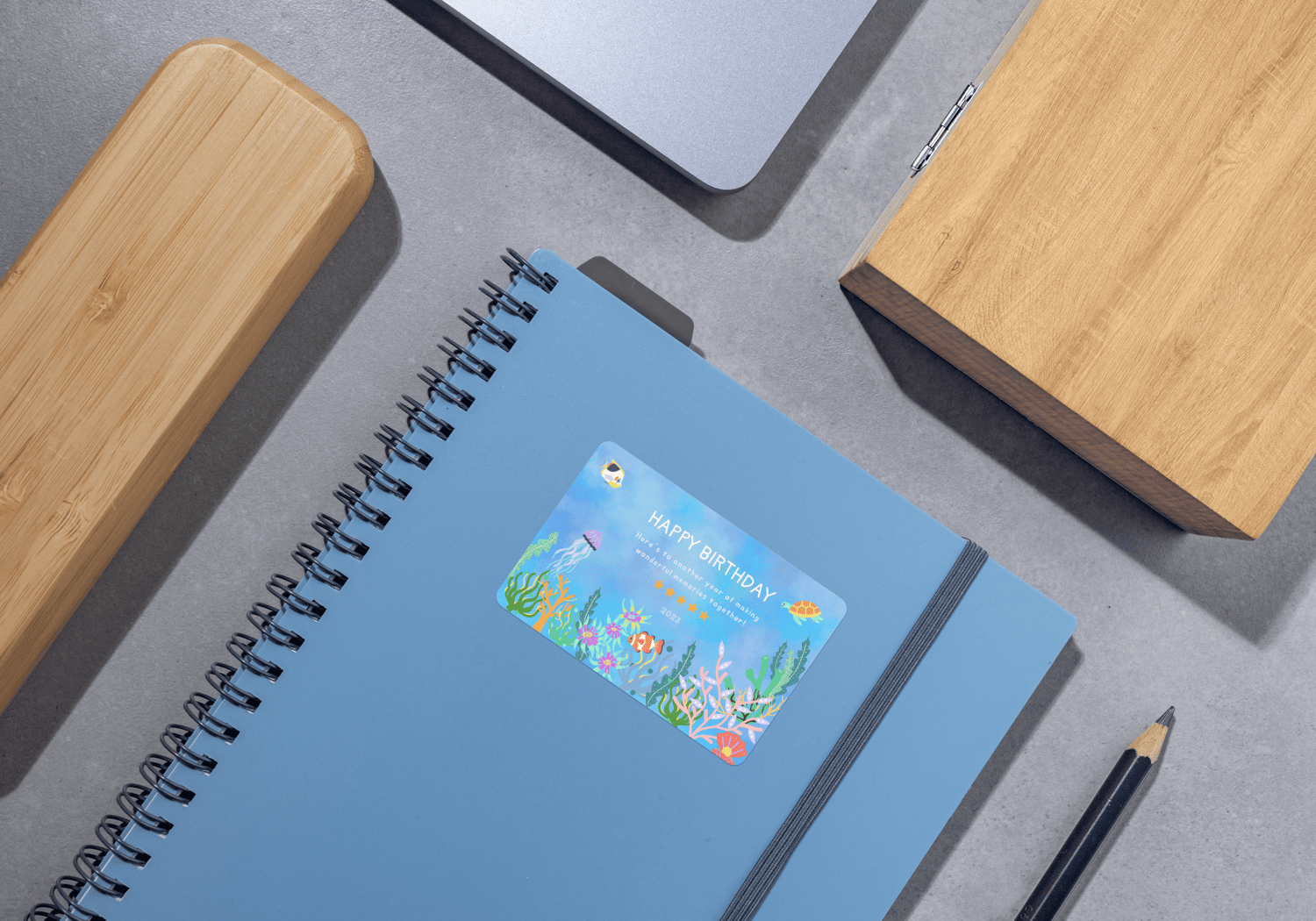 Vibrant Tropical Fish Design Sticker Label 3"x2" | Customizable Canva Template | Digital. Mock sticker on notebook