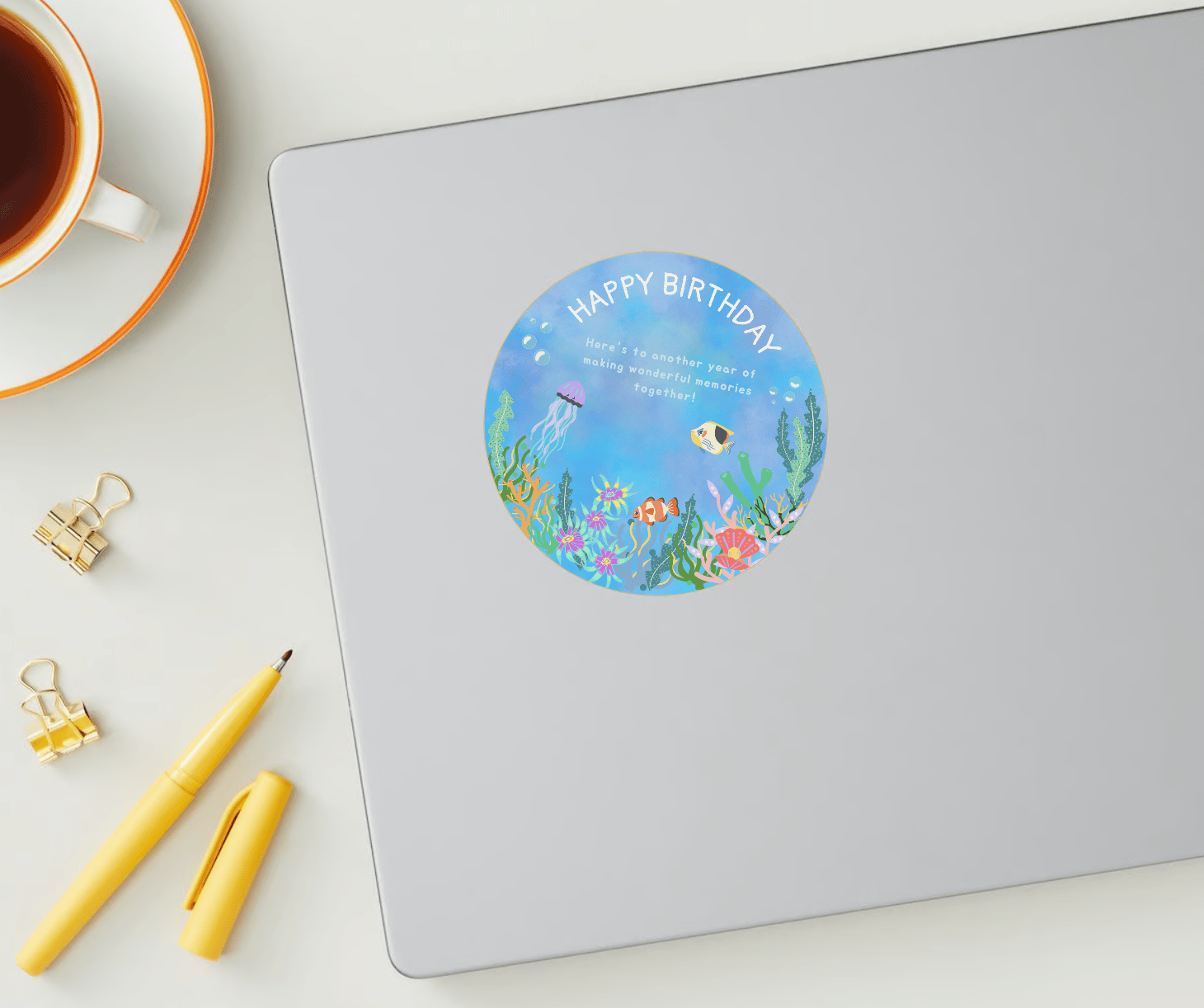 Vibrant Tropical Fish Design Circle Sticker | Customizable Canva Template | Digital. Mock sticker on laptop