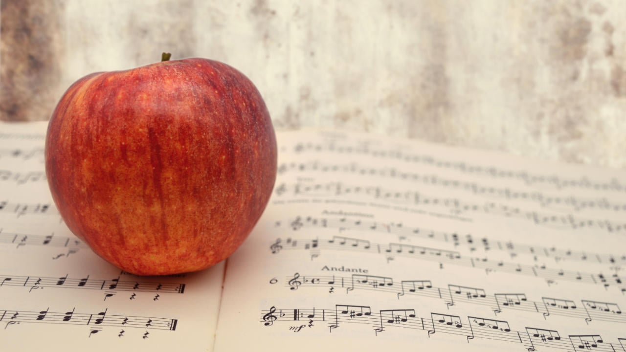 apple on sheet music book
