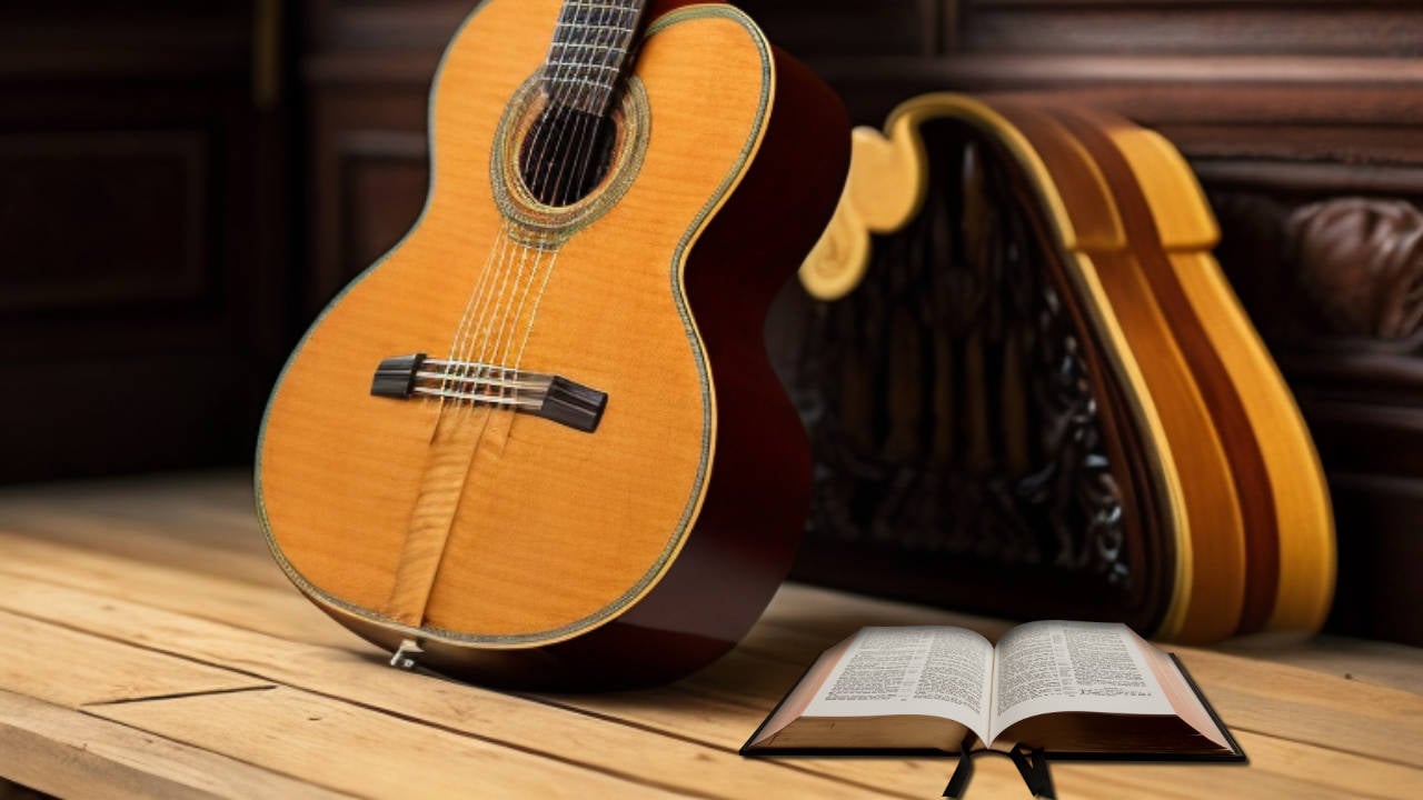 open bible on the floor with a guitar