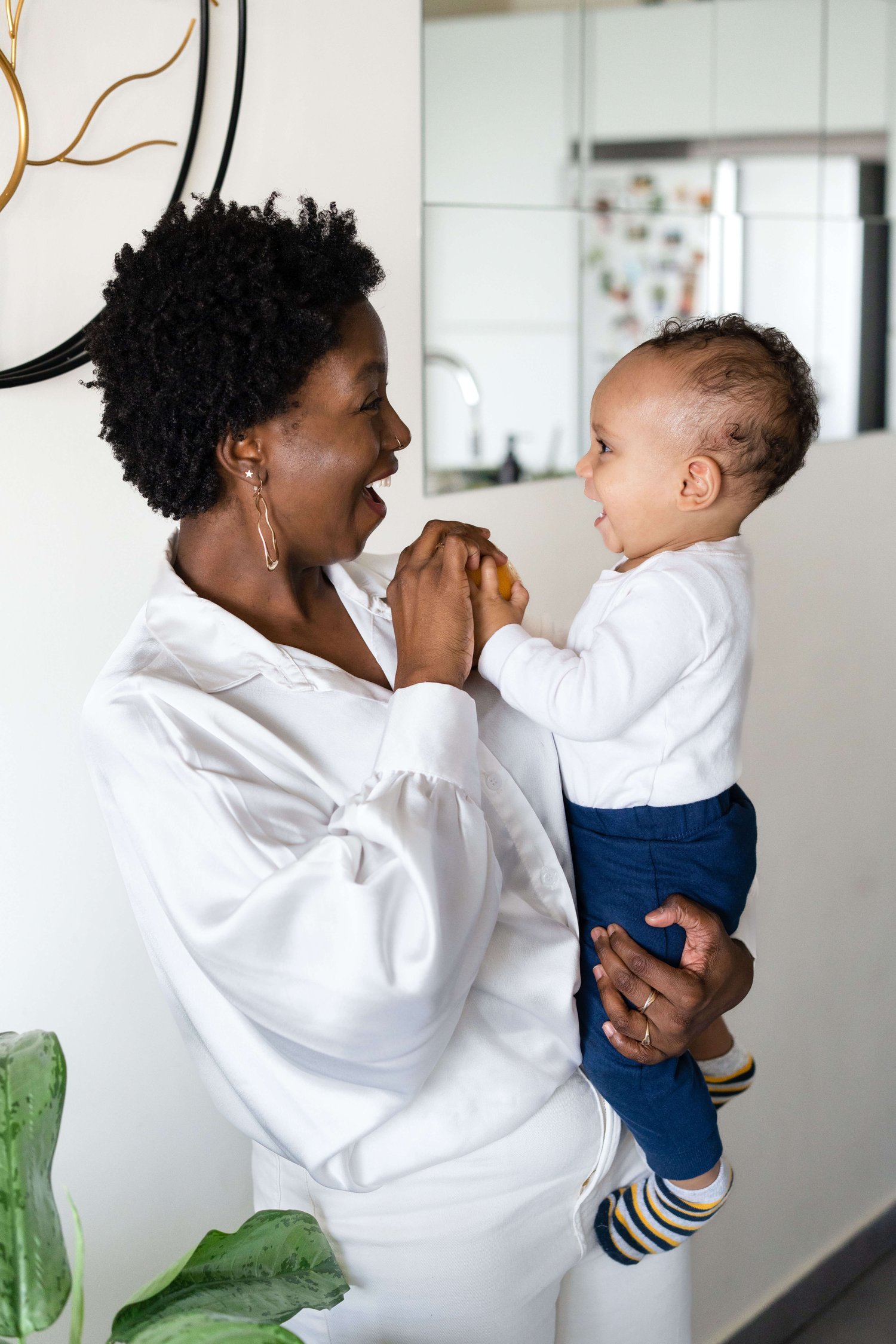 Saríce Holley, Registered Dietitian Nutritionist and Mom wellness advocate, sharing a candid mother-son moment filled with love, health, and wellness insights.