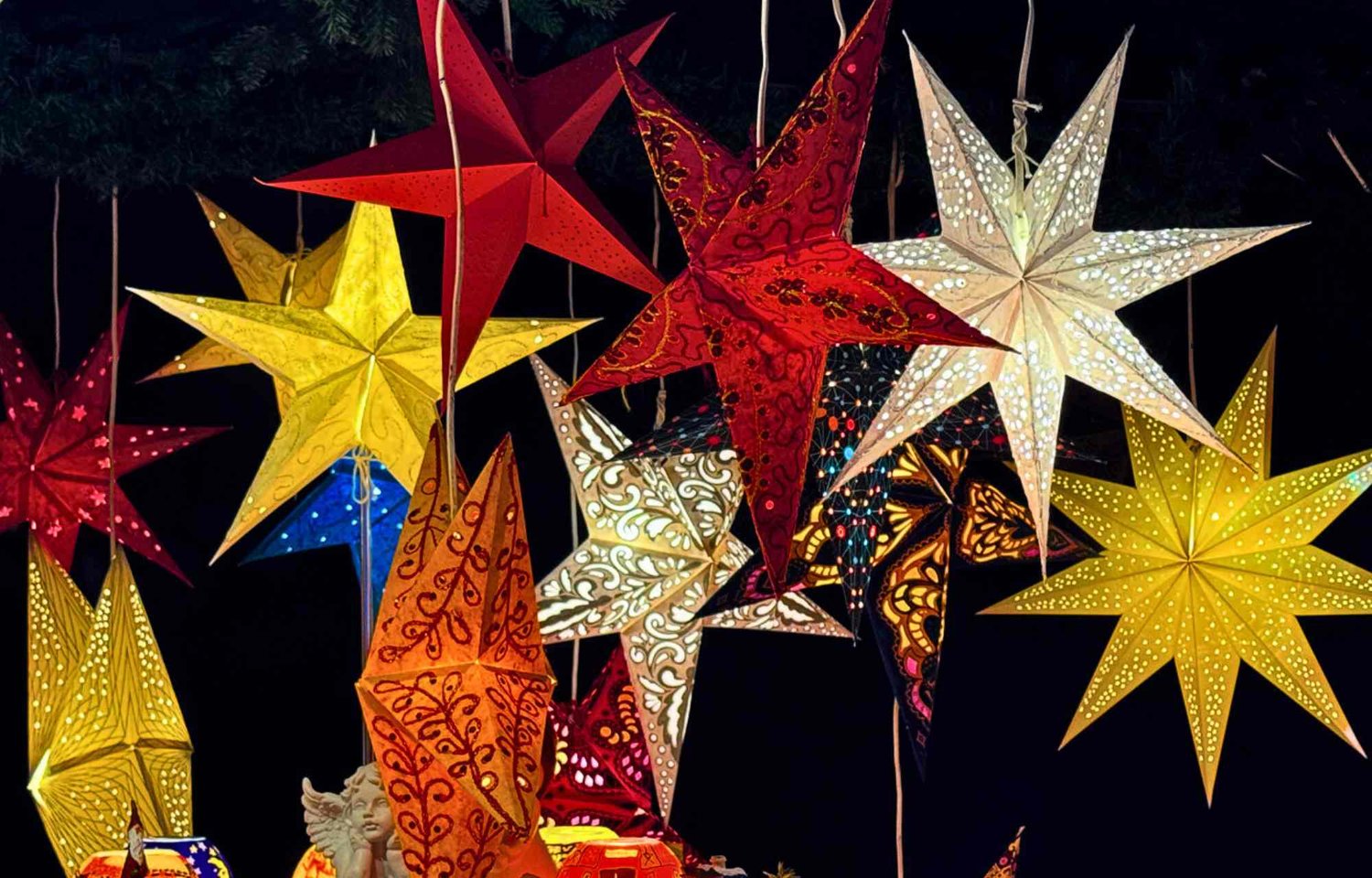 In the vibrant heart of Hamburg, there exists a portal to a realm of enchantment—the Christmas market, a shimmering gateway to a winter landscape where the tapestry of tradition and modernity seamlessly converges into a harmonious unity. Nestled with grace along the shores of the Binnenalster, this market unfolds like a grand spectacle, dressed in an elegant white design that bestows upon it an ethereal quality.  Here, amidst the pulsating heartbeat of the city, visitors are transported into a world where the spirit of Christmas materializes in a form of magic that is uniquely special. The "Weißerzauber" Christmas market at Jungfernstieg is not merely a destination; it is an immersive experience, a stage upon which festive anticipation dances alongside the showcasing of regional craftsmanship. It is a haven for those with an affinity for the finer things of the season, a paradise for enthusiasts of mulled wine and seekers of exquisite Christmas gifts.  In the prelude to Christmas, Jungfernstieg undergoes a metamorphosis, a breathtaking transformation into a sea of lights and colors that captivates both locals and visitors alike. The market becomes a living canvas, painted with the hues of joy and festivity, where every corner exudes a warmth that transcends the wintry chill. To wander through this luminous tapestry is to embark on a journey into the heart of Christmas itself.  A visit to the "Weißerzauber" Christmas market is not merely a recommendation—it is an invitation to experience the ineffable, to immerse oneself in the Christmas world of Hamburg. The air is infused with the aromas of seasonal delights, the sounds of laughter and shared moments reverberate through the market, creating an atmosphere that is as inviting as it is unforgettable.  Amidst the stalls adorned with beautiful Hamburg Christmas decorations, each piece becomes a storyteller, a reflection of the city's unique charm. The craftsmanship on display is not just artistry; it is a manifestation of the pride and creativity of the local community. To stroll through the market is to witness a celebration of heritage, where tradition and innovation coalesce in the most charming manner.  The shores of the Binnenalster provide a picturesque backdrop for this festive rendezvous, inviting visitors to linger and enjoy the magical ambiance. The elegant white design of the market, against the tranquil waters, creates a scene that is as timeless as it is contemporary, a visual symphony that complements the spirit of the season.  In the heart of Hamburg, the Christmas market at Jungfernstieg stands as a testament to the city's ability to infuse the holiday season with unparalleled charm. It is more than a market; it is a celebration of the beauty of Christmas decoration in Hamburg, a reflection of the city's unique identity, and an embodiment of the magic that resides in the union of tradition and modernity.