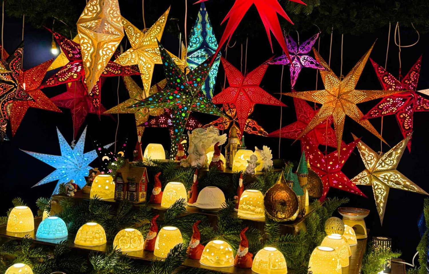 In the heart of Hamburg, the enchanting festivities of Christmas unfold along the illustrious Jungfernstieg, transforming the city into a winter wonderland adorned with the splendor of twinkling lights, festive craft stalls, and a nostalgic Ferris wheel that stands as a testament to the harmonious blend of tradition and modernity. The scene is nothing short of magical, an evocative spectacle that captures the spirit of the season with an unmatched charm.  As twilight descends upon the bustling city, the glittering lights along the Jungfernstieg come to life, casting a warm glow upon the cobbled pathways and the faces of cheerful revelers. The air is infused with the sweet aroma of mulled wine, wafting through the air and enticing passersby to partake in the seasonal delights that await them. The atmosphere is alive with laughter, the joyous chatter of families and friends echoing amidst the festive melodies that permeate the crisp winter air.  Craft stalls line the Jungfernstieg, each one a treasure trove of handmade wonders, showcasing the artistry and craftsmanship of local artisans. The air is filled with the melodies of Christmas carols, played by talented musicians, adding a symphonic backdrop to the visual feast that surrounds the gathering crowds. Hamburg's Christmas spirit is palpable, and as visitors meander through the stalls, they are greeted by an array of charming trinkets, unique gifts, and festive decorations that evoke a sense of nostalgia and warmth.  A historic Ferris wheel stands tall against the backdrop of the Binnenalster, its illuminated presence a beacon of joy that beckons all to experience the city's Christmas magic from a lofty vantage point. Families, couples, and friends embark on this enchanting ride, their laughter resonating through the night as they marvel at the panoramic views of the cityscape, embellished with the twinkle of a thousand lights.  Yet, the true masterpiece of this Christmas spectacle lies in the heart of the Binnenalster—the Christmas-decorated Alstertanne tree that stands majestically in the middle of the lake. Its branches adorned with glistening ornaments and lights, it radiates a timeless beauty that captures the essence of the season. The reflection of this resplendent tree in the calm waters of the Binnenalster creates a mirror image of festive perfection, a scene that is as picturesque as it is heartwarming.  Visitors to the Hamburg City Christmas Market find themselves immersed in a world where the past and present coalesce, where the vibrant energy of the city harmonizes with the timeless traditions of Christmas. Each step along the Jungfernstieg is a journey through a dreamscape of lights and colors, where the spirit of the season is not merely observed but embraced with open hearts.  In this beautiful tapestry of tradition and modern celebration, Hamburg's Christmas decor weaves a story of joy, togetherness, and the enduring magic that comes to life each year along the glittering expanse of the Jungfernstieg. It is a celebration that transcends time, inviting all who partake in its splendor to become a part of a cherished legacy—one that paints the city in the hues of a truly beautiful Christmas.