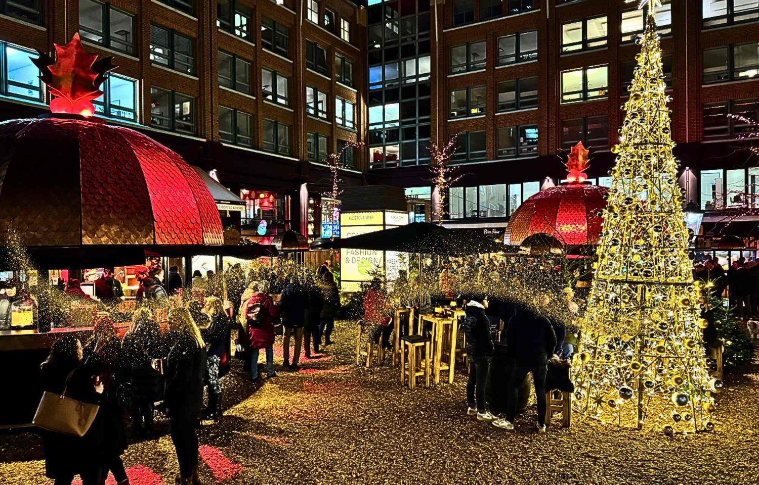 Discover the quintessential Christmas market to visit in Hamburg at the enchanting Stadthöfe Christmas Market located at Große Bleichen 35. If you're wondering where to go for Christmas in Hamburg, look no further than this festive haven that promises a magical experience for all.  Opening its gates daily from 12 am to 10 pm, the Stadthöfe Christmas Market stands out as a must-visit destination during the holiday season. Immerse yourself in the festive glow and culinary delights awaiting you from Monday to Sunday, providing ample time to explore and savor the unique atmosphere.  For those seeking the perfect answer to the question of where to go for Christmas in Hamburg, the Stadthöfe Christmas Market offers an ideal solution. Nestled within the historic walls of Bleichenhof, this market transforms into a winter wonderland, inviting visitors to bask in the warm ambiance of the season. Easily accessible via Große Bleichen, Stadthausbrücke, Bleichenbrücke, and Neuer Wall, it's a central location that beckons you to experience the best of Christmas in Hamburg.  Wondering what to see for Christmas in Hamburg? The Stadthöfe Christmas Market boasts the unique Marché de Noël, a focal point that captures the essence of French elegance and cozy luxury. Picture copper-colored mulled wine mugs, fur-covered seats, and festively adorned wooden huts creating an atmosphere that is both sophisticated and inviting.  The market spans approximately 1,000 square meters, featuring festive Christmas decorations that bathe the Stadthöfe in enchanting light. As you explore, discover additional Christmas markets within the Stadthöfe ensemble, including "Chez Noël" and "Petit Noël," each offering its own delightful experiences.  Delight your taste buds with treats such as crêpes, Leberkäse, and Kartoffelrösti at the Marché de Noël. If you find yourself captivated by Bleichenhof's offerings, rest assured there's more to explore within the Stadthöfe. This isn't just a market; it's a festive journey where the heart of the season comes alive.  As you navigate the Stadthöfe Christmas Market, take note of the live music performances every Friday and Saturday, adding a special touch to your Christmas experience. The golden fir tree sparkles against the drizzly backdrop, providing a picturesque setting for your holiday memories.  If you're seeking answers to what to see for Christmas in Hamburg, indulge in the sensory journey offered by the Stadthöfe Christmas Market. From the elegance of bronze-domed stalls to the inviting warmth of fur-covered seats, this market promises a captivating winter wonderland.  Embrace the spirit of the season as you explore the Stadthöfe Christmas Market in Hamburg. It's not just a market; it's a celebration of festive traditions, inviting you to make cherished memories in the heart of the city.