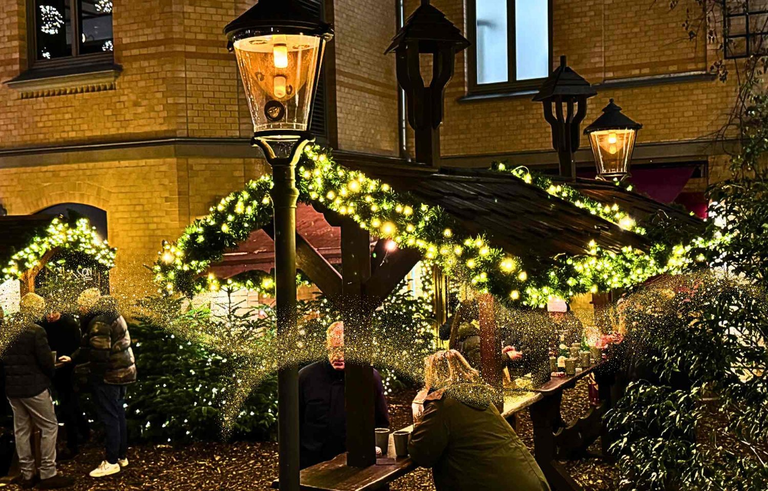 Step into the magical world of the Stadthöfe Christmas Market, located at Große Bleichen 35 in the heart of Hamburg. Renowned as the most beautiful Christmas market in Hamburg, this enchanting market promises a festive experience unlike any other. Opening its gates daily from 12 am to 10 pm, the Stadthöfe Christmas Market invites you to bask in the warm glow of holiday cheer.  Nestled within the historic walls of Bleichenhof, the Marché de Noël at Stadthöfe embodies a fusion of French elegance and cozy luxury. Picture copper-colored mulled wine mugs, fur-covered seats, and festively adorned wooden huts creating an atmosphere that is both sophisticated and inviting. It's a sensory journey through festive delights that captures the essence of the season.  For an insider tip, don't miss the large music lineup every Friday and Saturday evening, setting the perfect backdrop for your magical Christmas experience. Let the harmonious tunes guide you through the market, enhancing the festive atmosphere.  Immerse yourself in the Christmas spirit at the Stadthöfe Christmas Market, where the historic Bleichenhof transforms into a winter wonderland. Easily accessible via Große Bleichen, Stadthausbrücke, Bleichenbrücke, and Neuer Wall, this market invites you to explore and indulge in the season's joys.  The "Marché de Noël" is a gastronomic delight, offering treats such as crêpes, Leberkäse, and Kartoffelrösti. If the offerings at Bleichenhof aren't enough, the Stadthöfe has more to offer with neighboring Christmas markets like "Chez Noël" and "Petit Noël."  The heart of the Stadthöfe Christmas Market is the Marché de Noël at Bleichenhof, a central meeting point that captivates with its unique ambiance. Imagine cozy seating with fur throws, copper domes atop large round huts, and wooden shavings for warm feet. The market spans approximately 1,000 square meters, creating an intimate yet festive space.  Explore the adjacent markets within the Stadthöfe ensemble – Chez Noël in the Palaishof and Petit Noël in the magical Treppenhof of TORTUE. Each market offers its own delights, from mulled wine and crêpes to ice stock shooting, providing a diverse range of experiences within walking distance.  Live music on Fridays and Saturdays adds a special touch to the Stadthöfe Christmas Market. As the golden fir tree sparkles against the drizzly backdrop, savor white or red mulled wine from elegant copper mugs at Bleichenhof. For those seeking a touch of luxury, indulge in a glass or bottle of champagne amidst the elegant and rustic ambiance.  Indulge in the magic of a French-inspired Christmas at Stadthöfe, where the Marché de Noël weaves a tapestry of luxury and cozy charm. Whether you're sipping mulled wine, exploring neighboring markets, or reveling in the live music, every visit becomes a celebration of festive traditions. The Stadthöfe Christmas Market is a captivating experience, inviting you to embrace the spirit of the season in the heart of Hamburg.