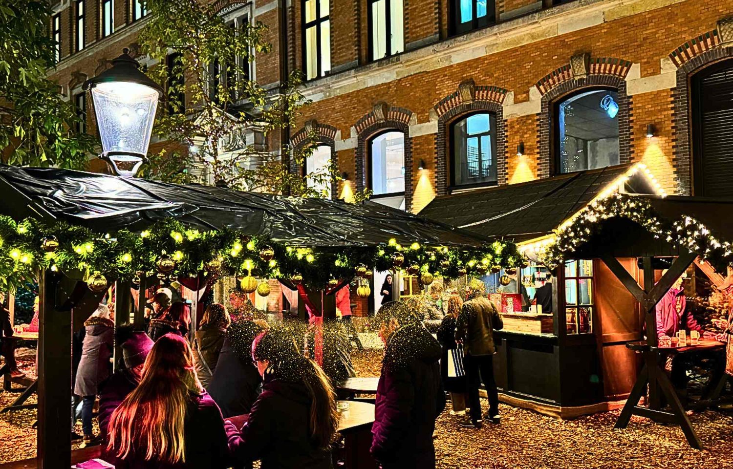 If you're wondering where to go for the best Christmas in Hamburg, look no further than the Stadthöfe Christmas Market at Große Bleichen 35. Renowned for its enchanting atmosphere and festive offerings, it stands out as the perfect destination for those seeking the pinnacle of Christmas celebrations.  Open daily from 12 am to 10 pm, the Stadthöfe Christmas Market is a prime location for experiencing the best of the holiday season in Hamburg. Immerse yourself in the festive glow and culinary delights available every day, creating an ideal setting for a memorable Christmas experience.  For those in search of the most beautiful Christmas decorations in Hamburg, the Stadthöfe Christmas Market offers a visual feast. Adorning the market are stunning copper-colored mulled wine mugs, fur-covered seats, and festively decorated wooden huts that collectively create an ambiance of refined elegance and holiday charm.  If you're on the hunt for the best Hamburg Christmas decor, the Stadthöfe Christmas Market takes center stage. Spanning approximately 1,000 square meters, this market showcases a masterful display of festive Christmas decorations that bathes the entire Stadthöfe ensemble in an enchanting light.  Discover the most beautiful spots for Christmas in Hamburg as you explore the heart of the city's festivities at Stadthöfe. Easily accessible via Große Bleichen, Stadthausbrücke, Bleichenbrücke, and Neuer Wall, it stands as a central and inviting location to experience the magic of the season.  As you wander through the market, take in the exquisite live music performances every Friday and Saturday, enhancing the overall charm of the Stadthöfe Christmas Market. The golden fir tree sparkles against the backdrop of drizzling lights, creating a picturesque setting that adds to the allure of the festive season.  Indulge your senses in the most beautiful Christmas decor in Hamburg at the Stadthöfe Christmas Market. From the elegant bronze-domed stalls to the inviting warmth of fur-covered seats, this market transforms into a captivating winter wonderland, making it the best spot for experiencing the magic of Christmas in Hamburg.  For those in search of the most beautiful and enchanting Christmas celebrations, the Stadthöfe Christmas Market stands out as the ultimate destination. It's not just a market; it's a visual and sensory journey through the best Christmas decor Hamburg has to offer. Embrace the spirit of the season and create cherished memories at this extraordinary Christmas destination in the heart of Hamburg.