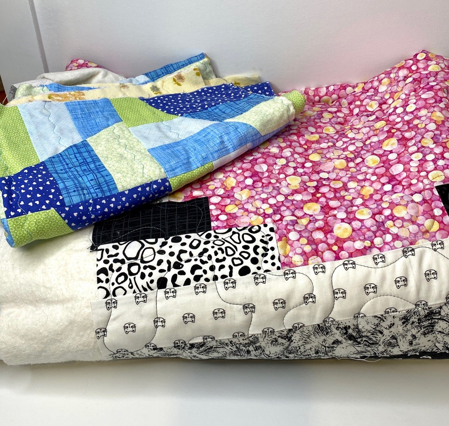 A sample selection of my Unfinished quilts pile.