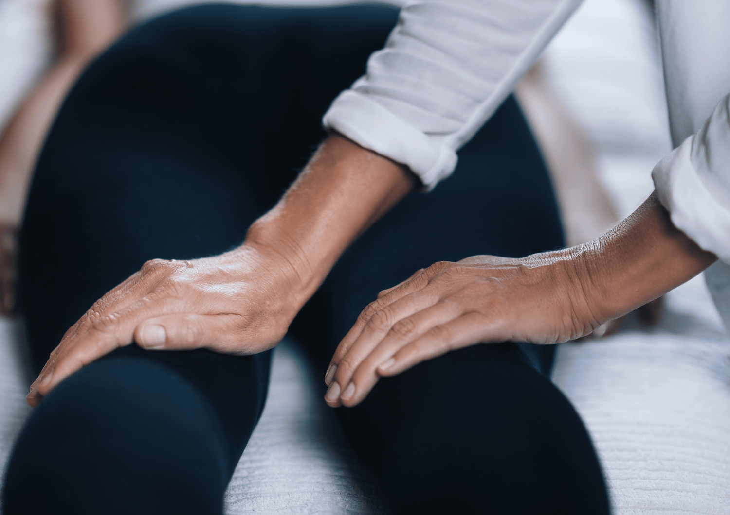 Reiki treatment hands on knees