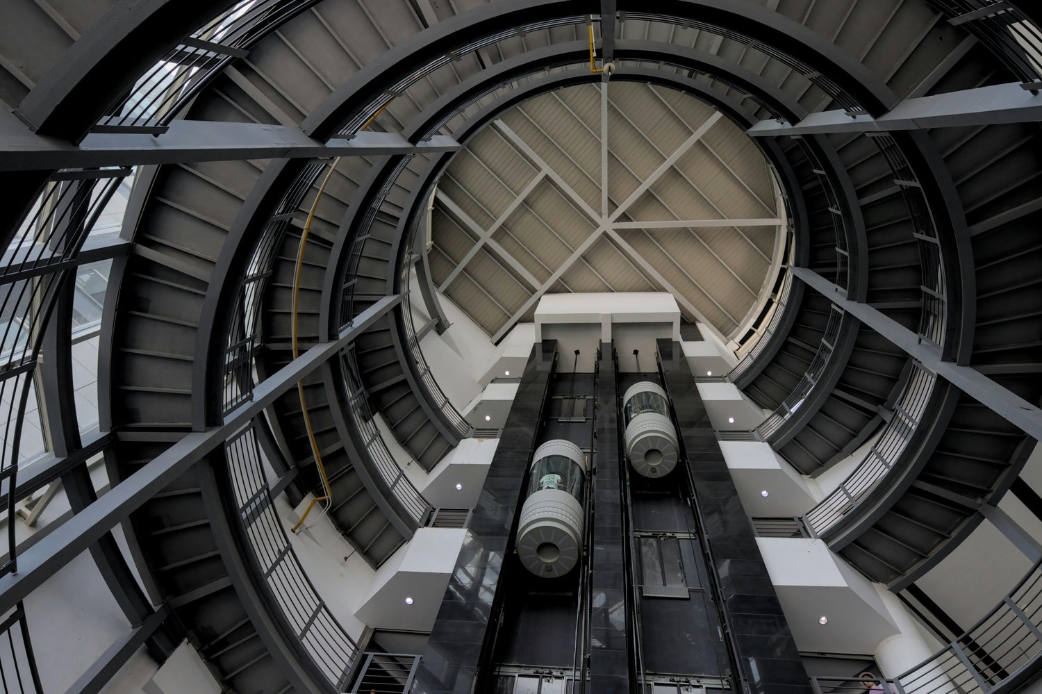 Spiral Staircase and Elevators | Photo by Kampamba from Pexels