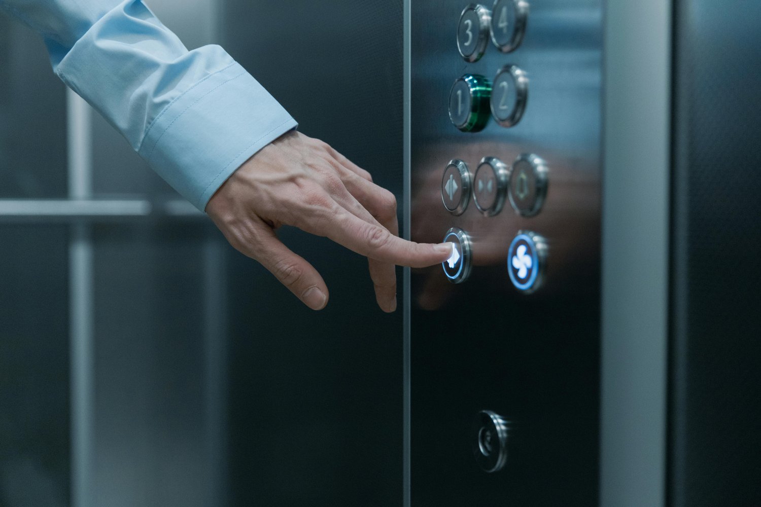 Shot of a Hand Pressing an Elevator Button | Photo by cottonbro studio via Pexels