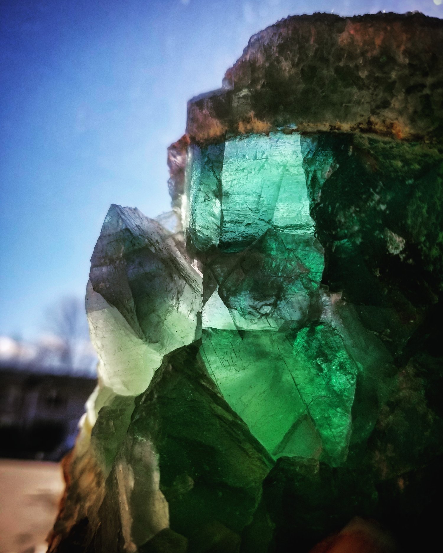 piece of raw rainbow fluorite in the matrix