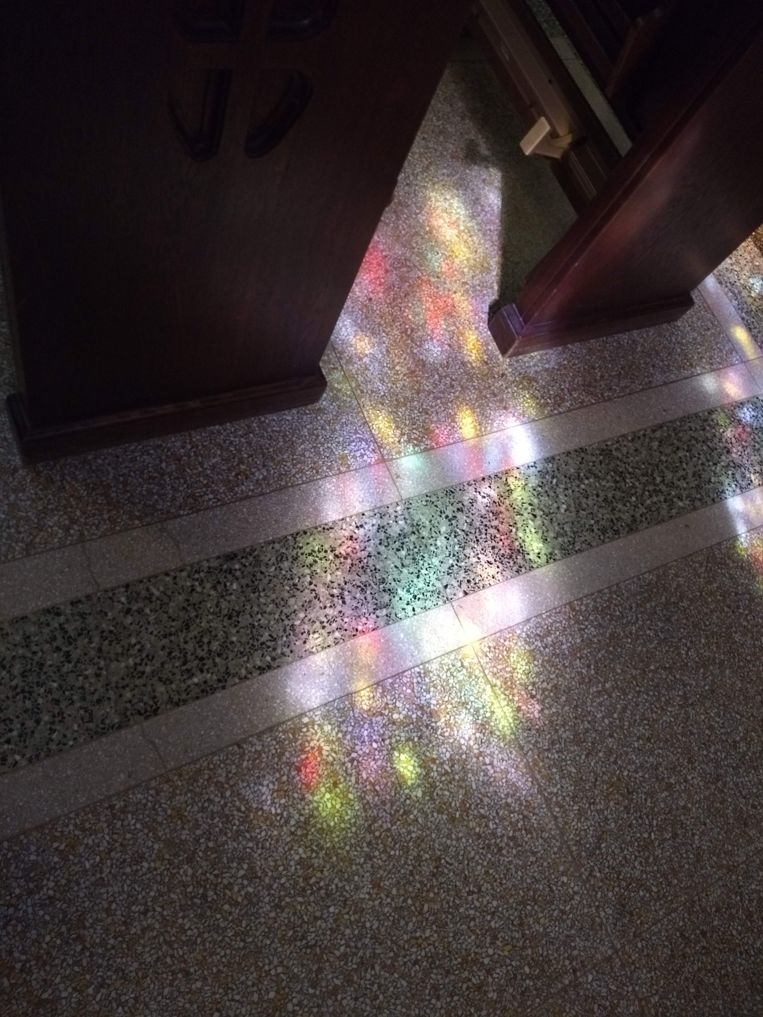 Sunlight Streaming through StainGlass windows and Reflecting off the Polished Church Floors
