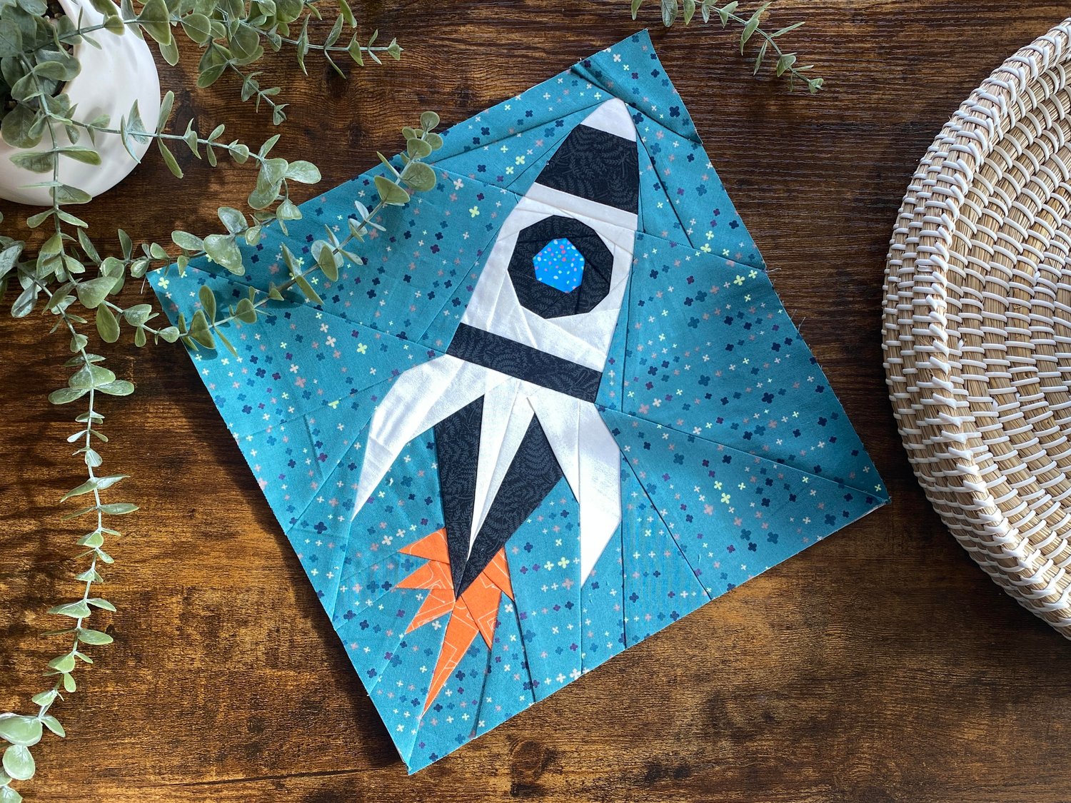 I wasn't going to let that last fabric scrap go to waste, so I added it to my Rocket Ship Quilt block!