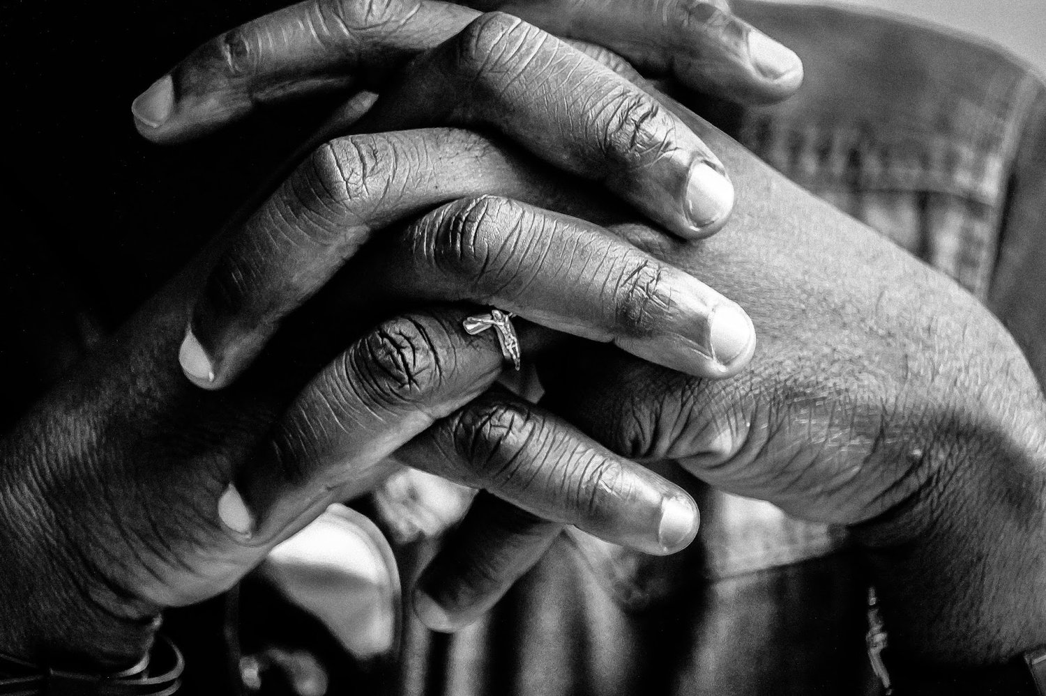 praying hands of a black man