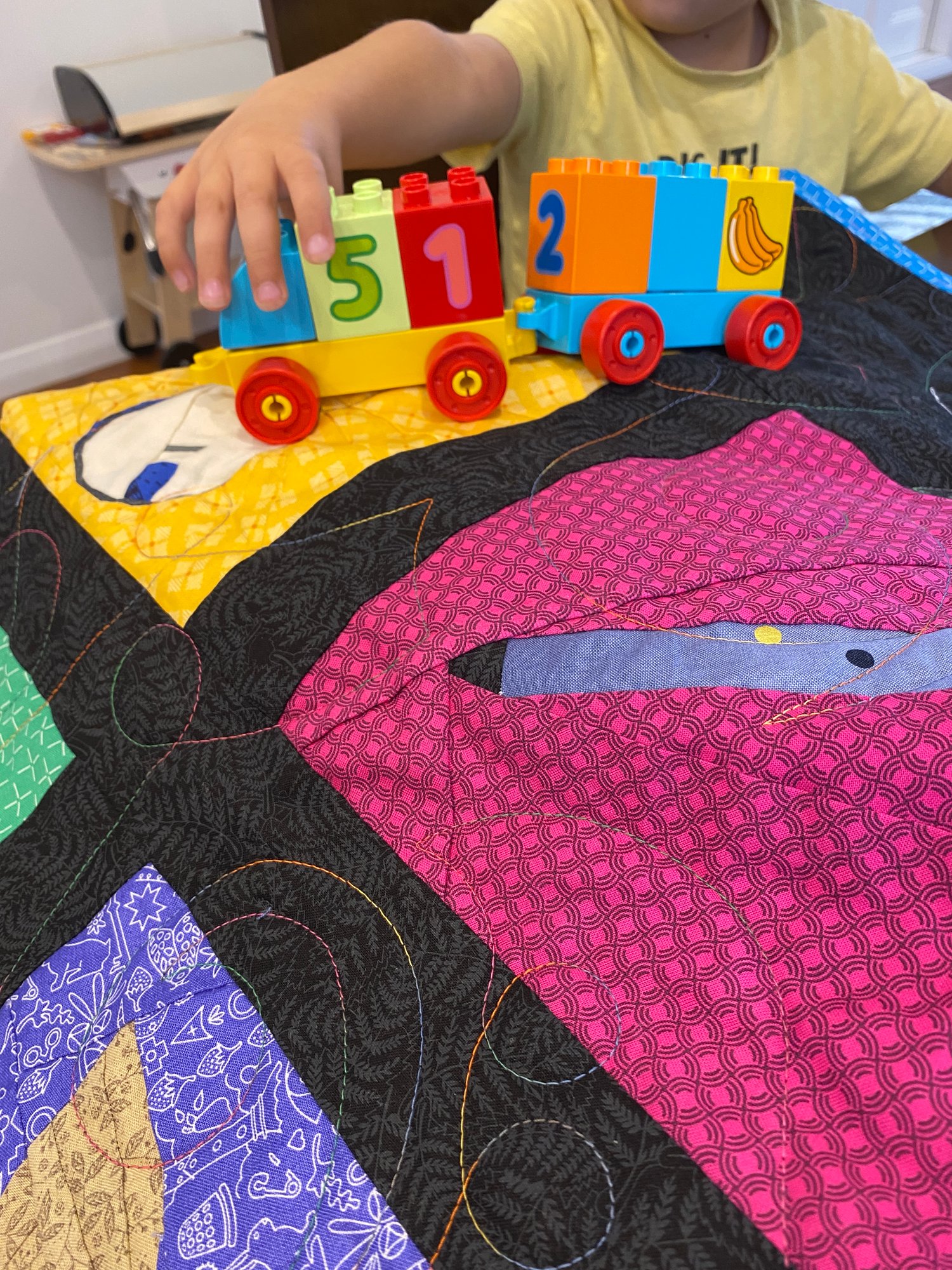 My son likes to drive his cars on quilts while I’m sewing. It helps to make him feel involved in my quilting and I get more time behind the sewing machine.
