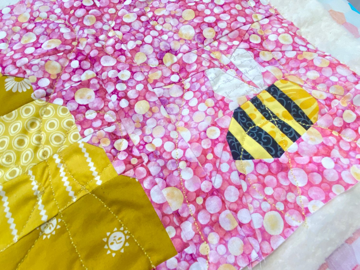 This is an example of the quilting I did on my Bumblebee Table Runner Quilt. I used a fancy stitch on my sewing machine to achieve this look.