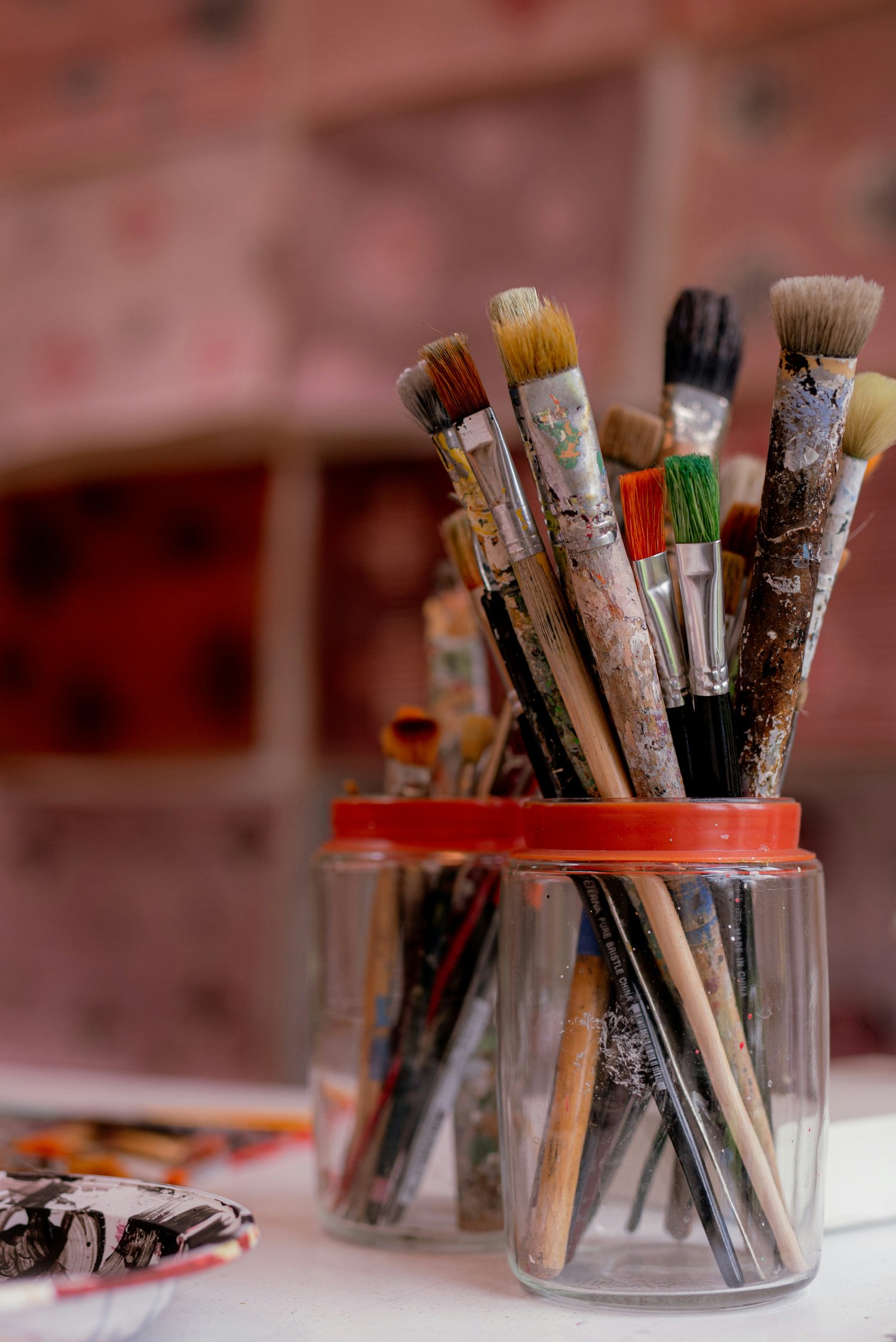 Jar full of paintbrushes