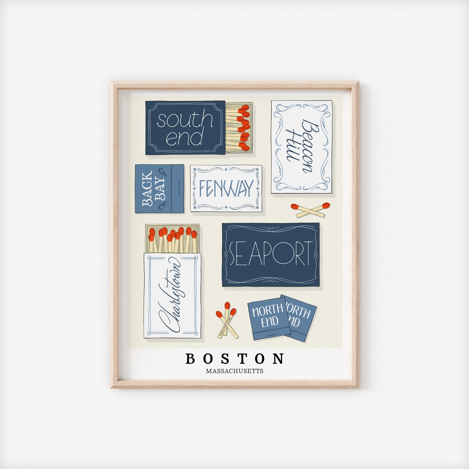 A framed picture of Boston, Massachusetts neighborhoods drawn in various lettering styles on matchboxes. Artwork has a blue and white color scheme.
