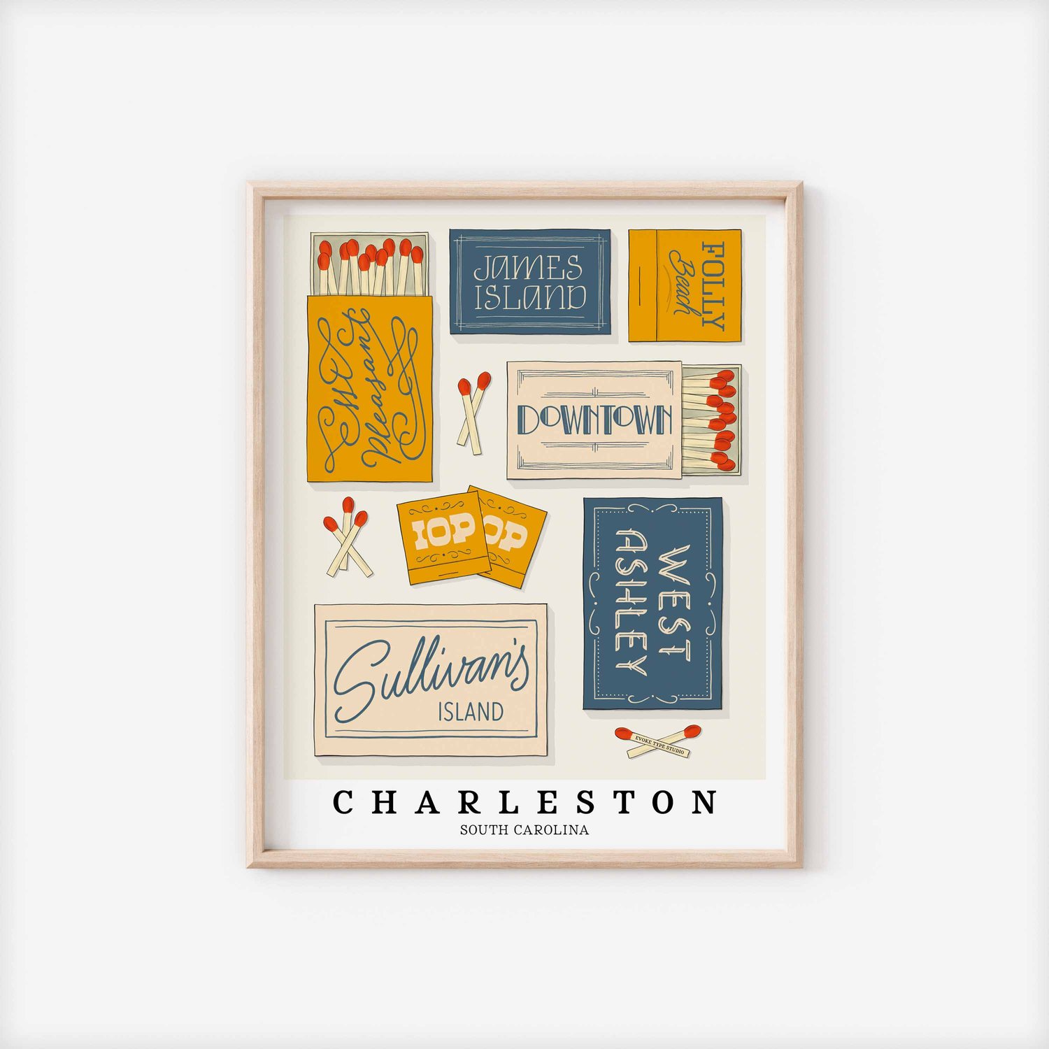 A framed picture of Charleston, South Carolina neighborhoods drawn in various lettering styles on matchboxes. Artwork has a blue, yellow and beige color scheme.