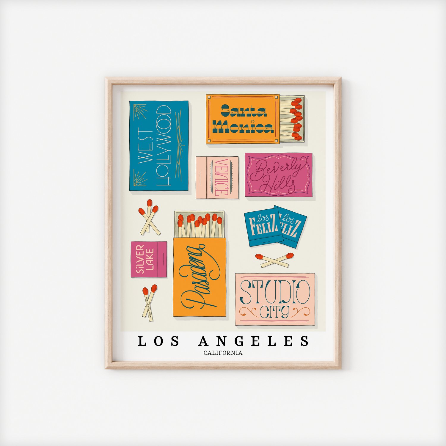 A framed picture of Los Angeles, California neighborhoods drawn in various lettering styles on matchboxes. Artwork has a bold and bright color scheme of vibrant blues, oranges and pinks.